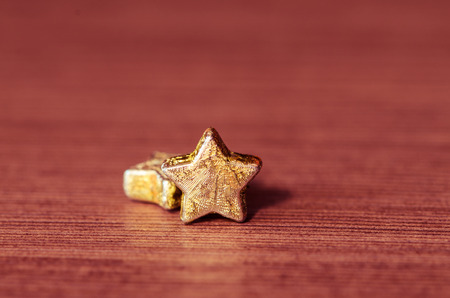 two golden stars on violet backgroundの写真素材