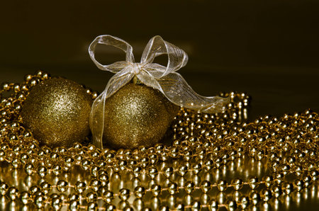 golden christmas ball and golden ribbon decorationの写真素材
