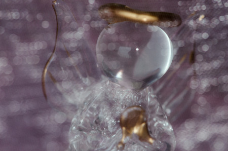 glass angel on purple backgroundの写真素材