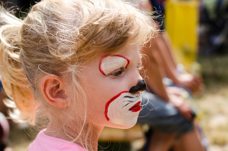 blond girl with face painting