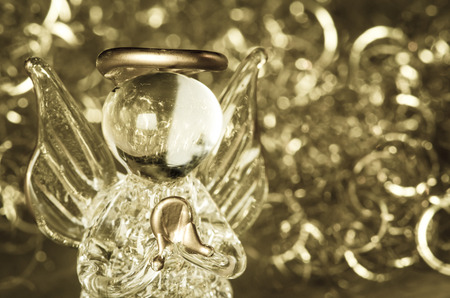 little vitreous angel  on silver backgroundの写真素材