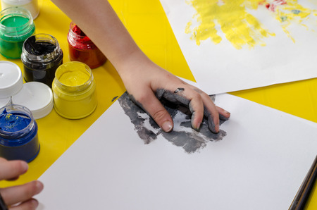 colorful colors and hand on paperの写真素材