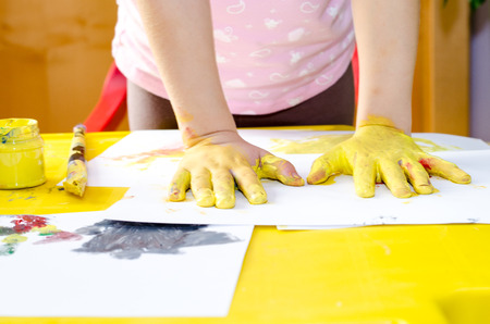 colorful colors and hands prints on paperの写真素材