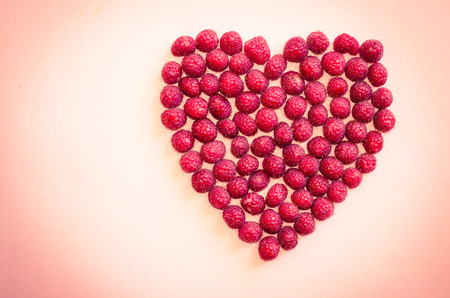 heart from red ripe cranberries