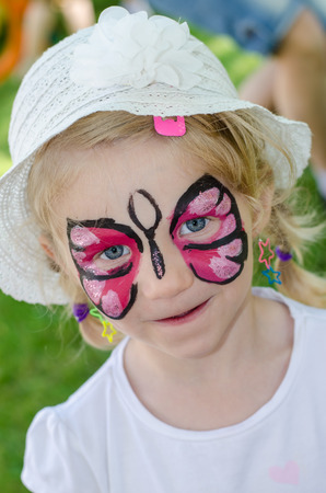 blond girl with face painting