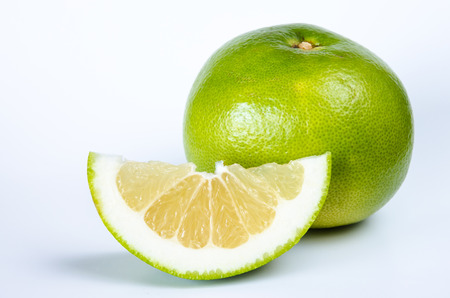 green grapefruit fruit over white background