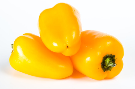 yellow pepper vegetables over white background