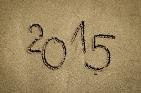2015 number written into sand on beachの写真素材