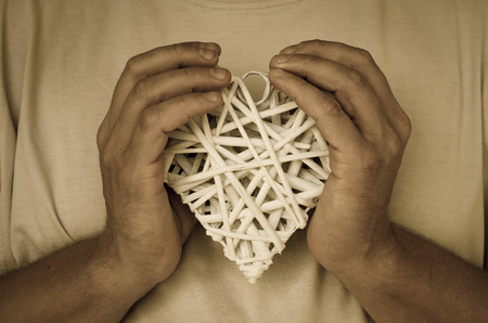 detail of white heart in handsの写真素材