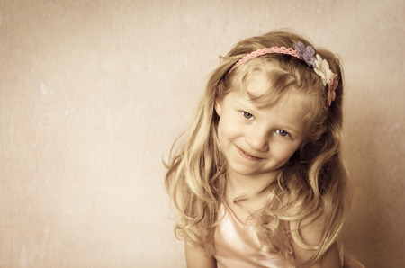 portrait of beautiful blond girl with home hand made headbandの写真素材