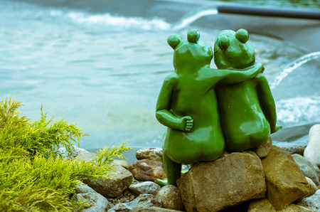 porcelain couple of green frogsの写真素材