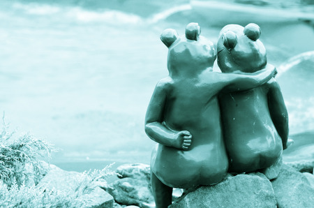 porcelain couple of green frogsの写真素材