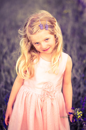 blond girl in pink dress retro effectの写真素材