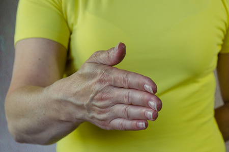 open hand waiting to shake someones handの写真素材