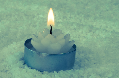 white flower candle and white sea saltの写真素材
