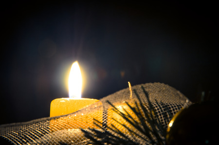 one burning candle in advent wreathの写真素材