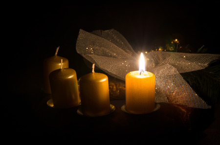 one burning candle in advent wreathの写真素材