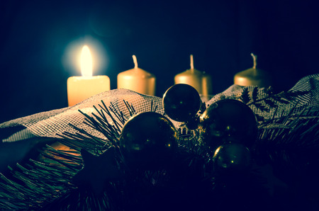 one burning candle in advent wreathの写真素材