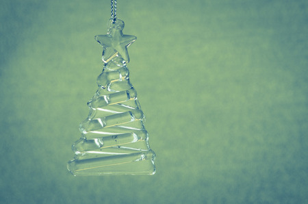 crystal christmas tree decoration against blue backgroundの写真素材