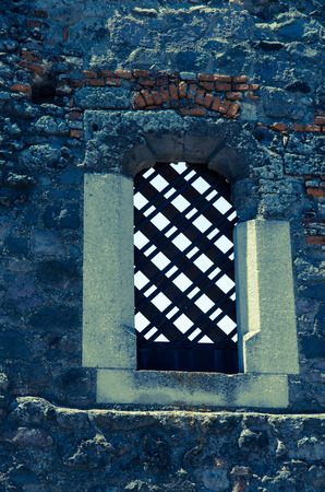 ancient window in stoned wallの写真素材