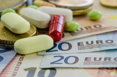 euro banknotes with different denomination and pillsの写真素材