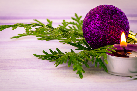 pink burning candle and pink baubleの写真素材