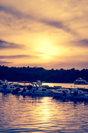 yellow orange blue sunset in harbourのeditorial素材