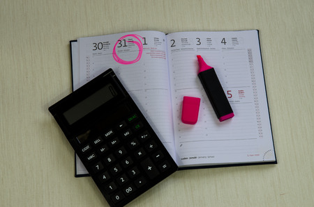 open calendar with marked date for deadline payment and red markerの写真素材