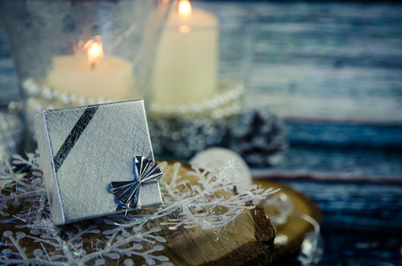 silver present box and burning candles decorationの写真素材