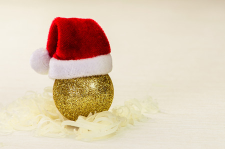 golden Christmas bauble with red Santaの写真素材