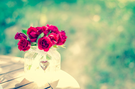 bunch of beautiful red roses in vaseの写真素材