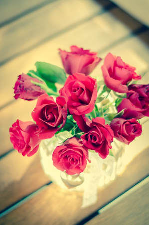 bunch of beautiful red roses in vase top viewの写真素材