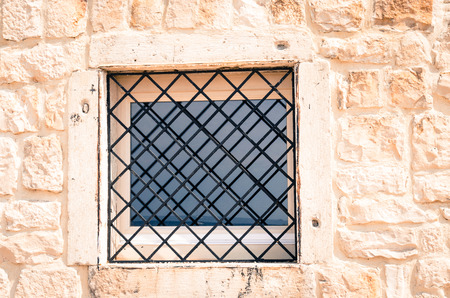 trellis glass window in wallの写真素材