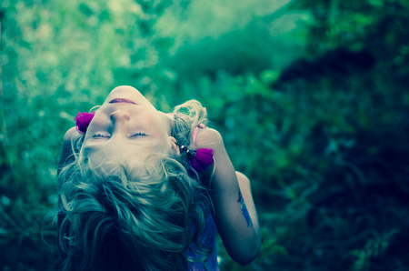 lovely blond girl with closed eyes portraitの写真素材