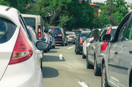 cars in convoy on the road
