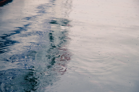 raindrops in sea water surfaceの写真素材