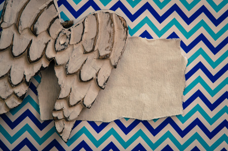 white soft wooden wings decoration against blue patternの写真素材