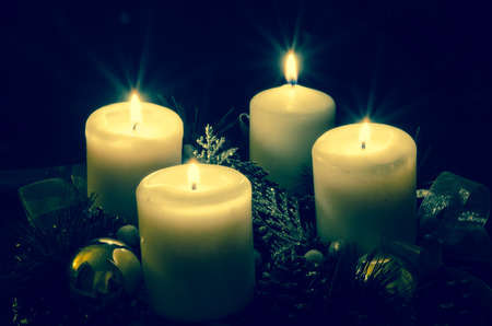 advent candleholder with four burning candlesの写真素材