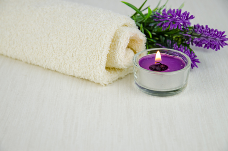 lavender flower on white towel decoration and burning candleの写真素材