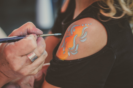 little lovely bbeeing painted on the armの写真素材