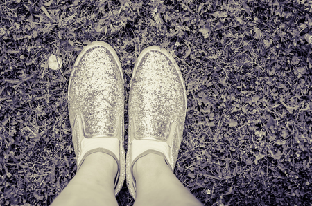 top view of silver shoes in grassの写真素材