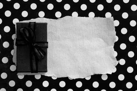 retro styled present box with dotted backgroundの写真素材