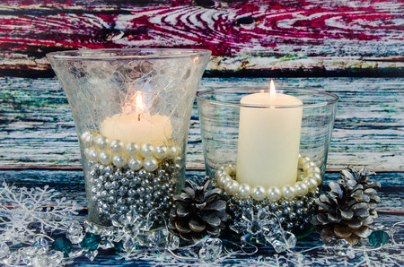 white burning candles against blue backgroundの写真素材