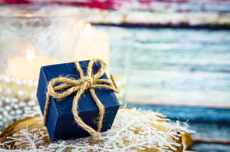 blue christmas present box with  ribbon against white backgroundの写真素材