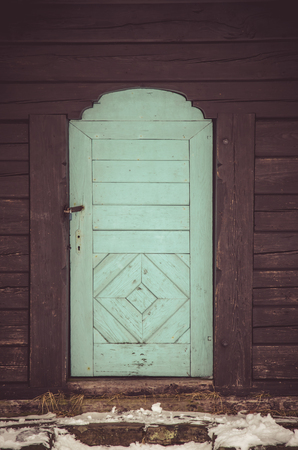 white wooden closed doors in wooden houseの写真素材