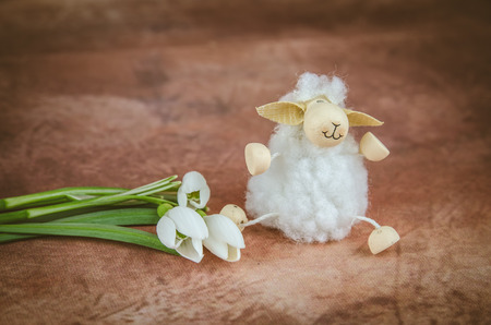 Easter sheep and white spring snowdrop