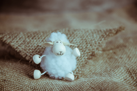 lovely white happy smiling Easter sheep toyの写真素材