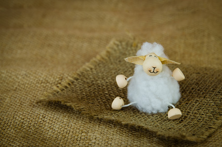lovely white happy smiling Easter sheep toyの写真素材