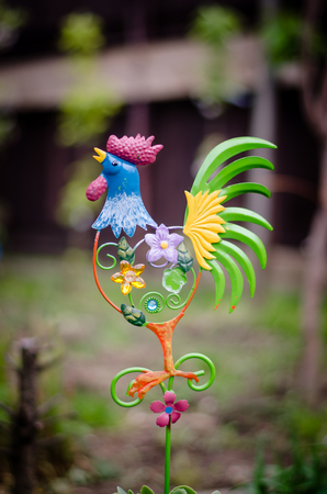 beautiful decoration of colorful cock in the gardenの写真素材