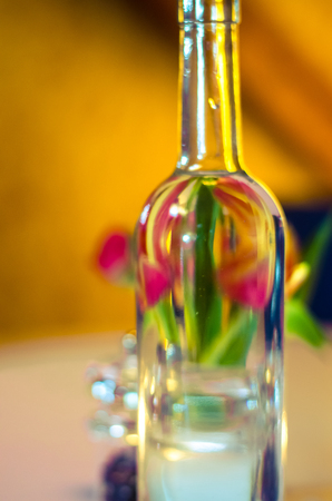 tulips reflectin in transparent bottleの写真素材